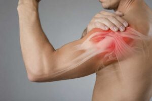 Man holding his shoulder with highlighted pain in the rotator cuff area